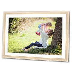 Picture framing featuring a photo of a mother and child playing